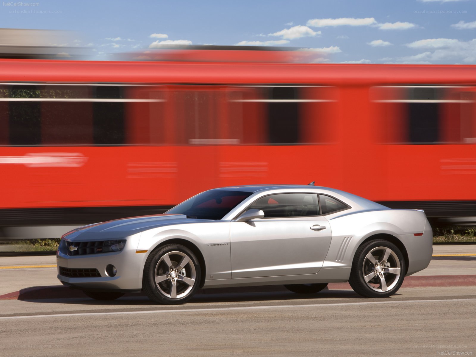 Silver Chevrolet Camaro on road