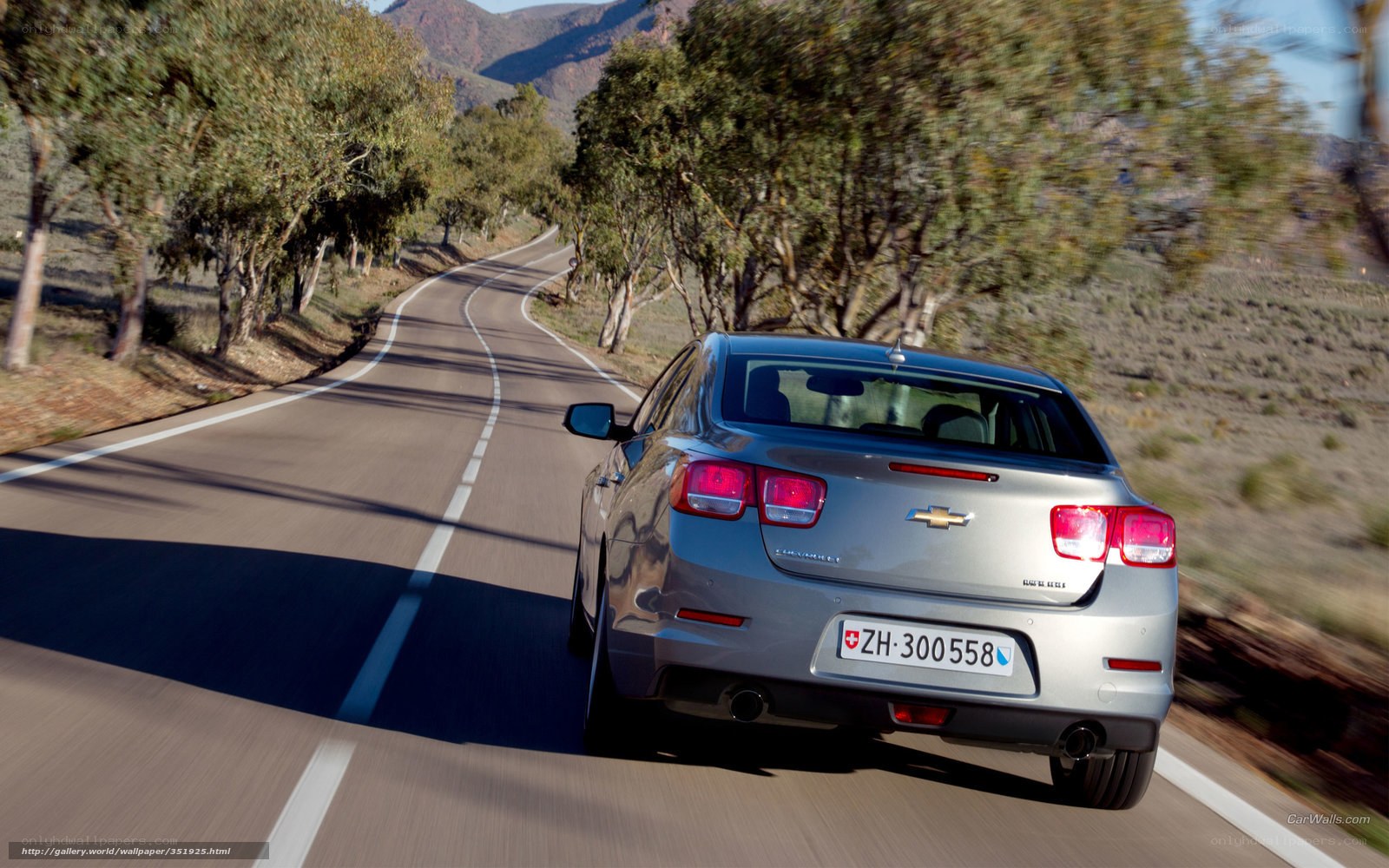 silver chevrolet driving on road