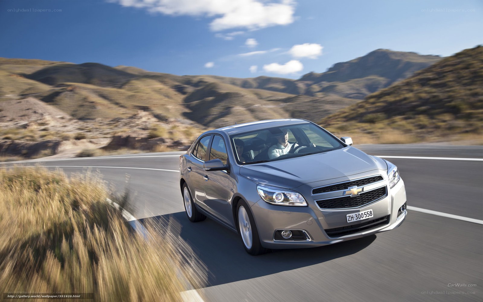 silver chevrolet driving on road
