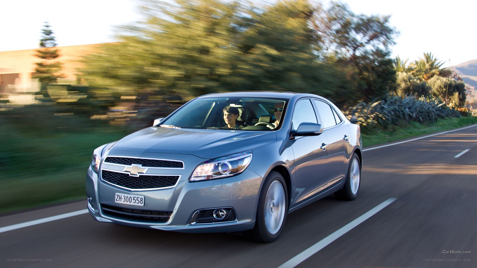 silver chevrolet malibu driving