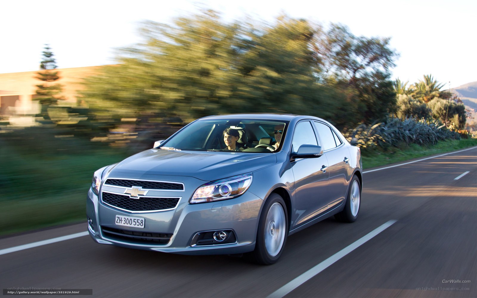 silver chevrolet malibu driving