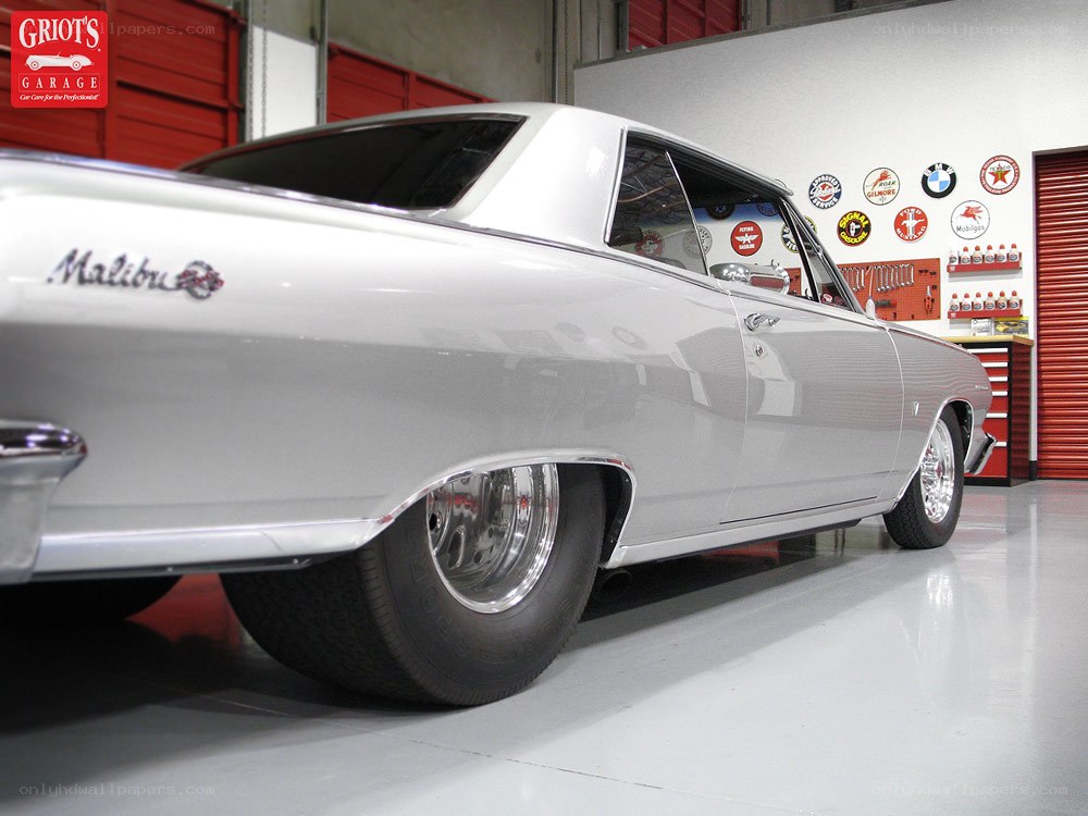 silver chevrolet malibu in garage