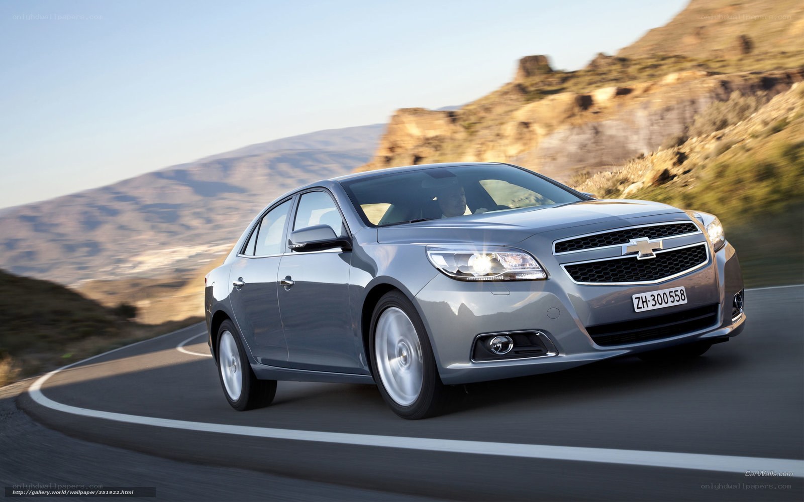 Silver Chevrolet Malibu on a winding road