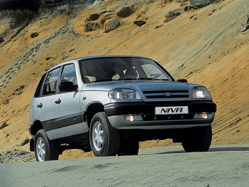 Silver Chevrolet Niva on a dirt road
