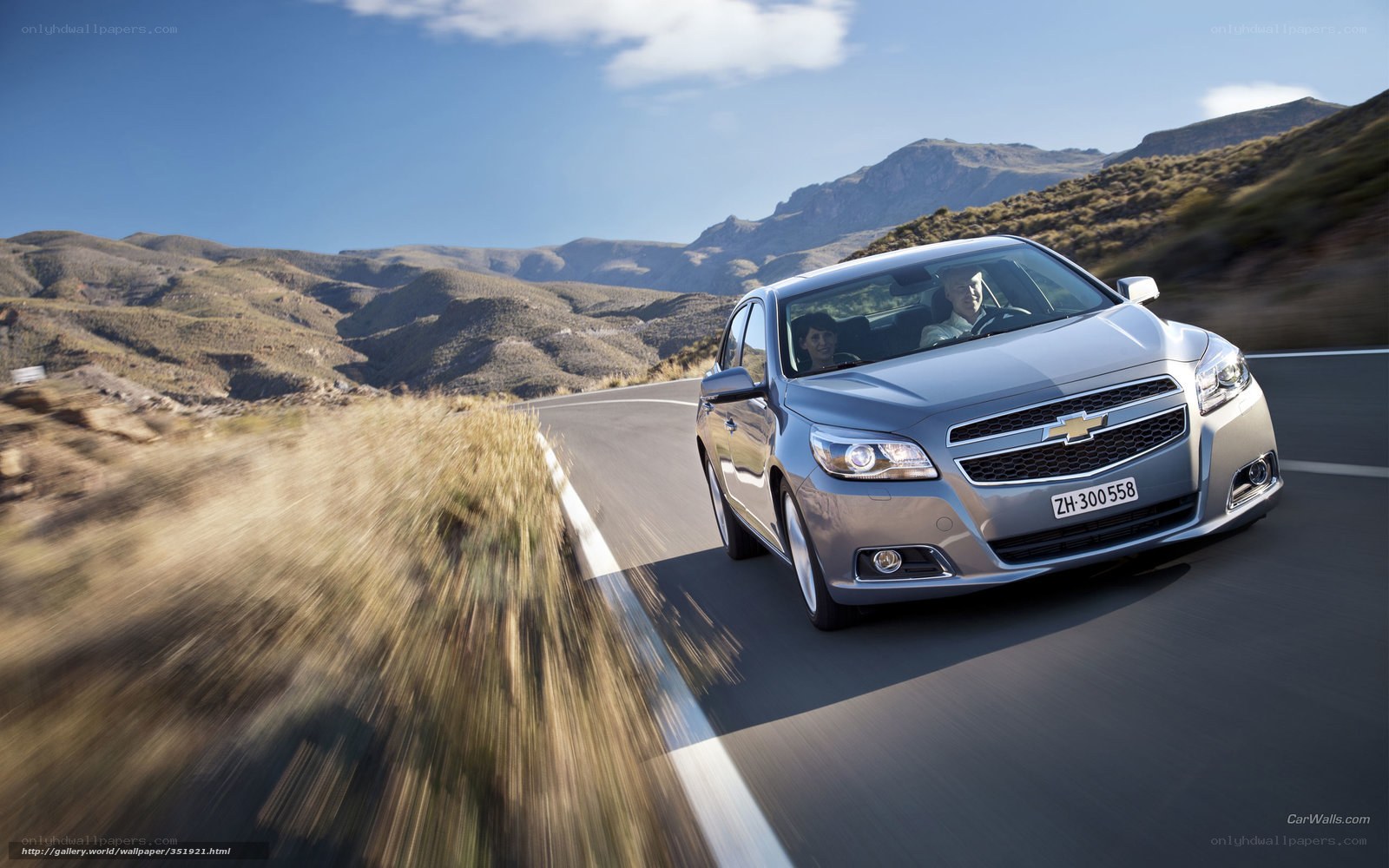 Silver Chevrolet on mountain road