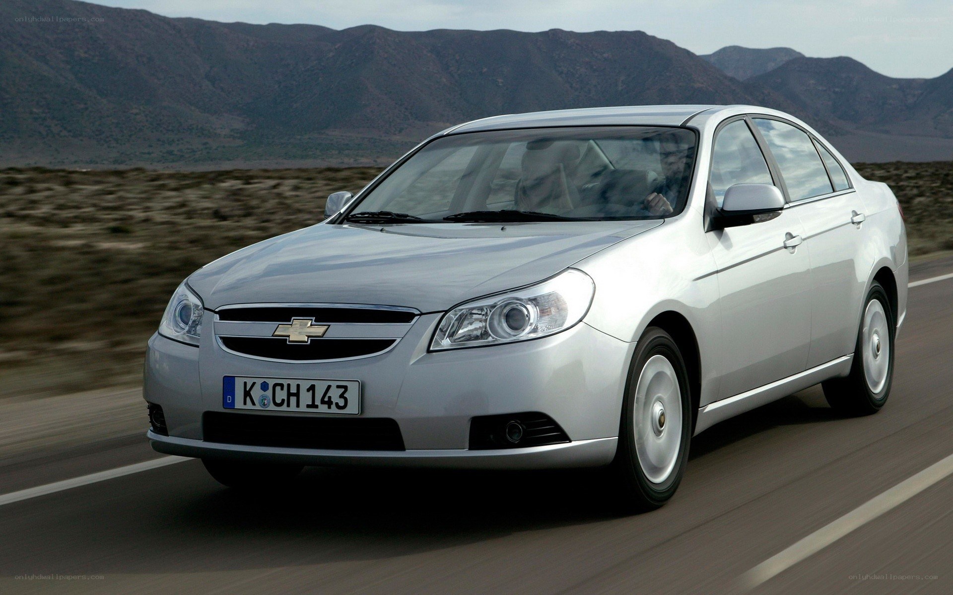 silver chevrolet on road