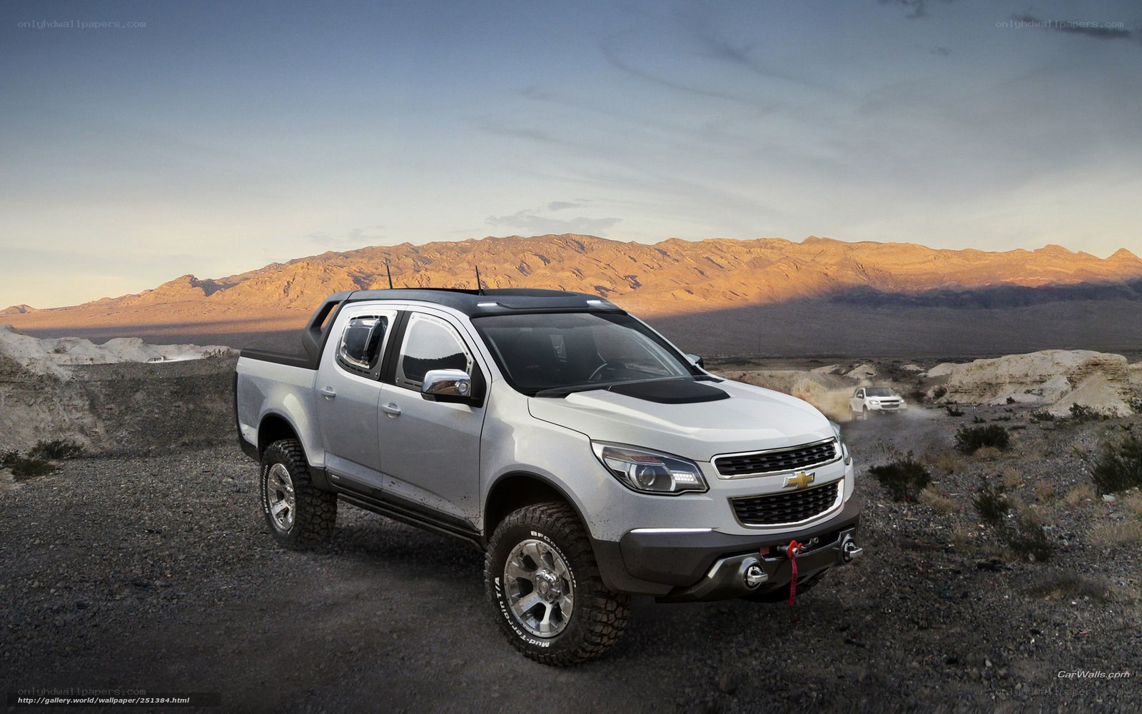 Silver Chevrolet pickup in desert