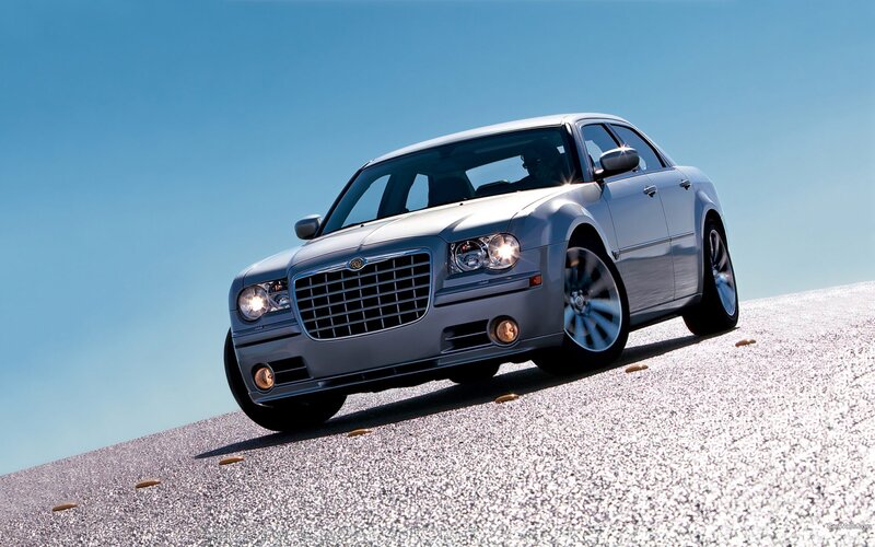 silver chrysler 300 on gravel