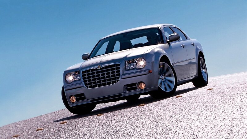 silver chrysler 300 on gravel