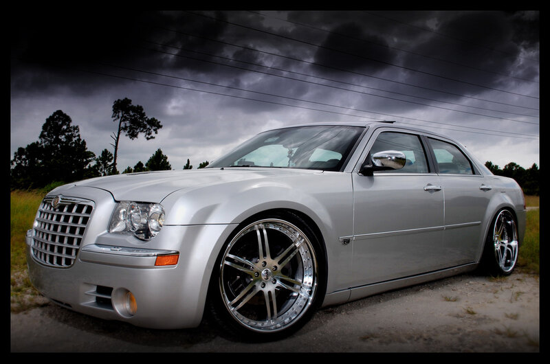 silver chrysler 300 on gravel