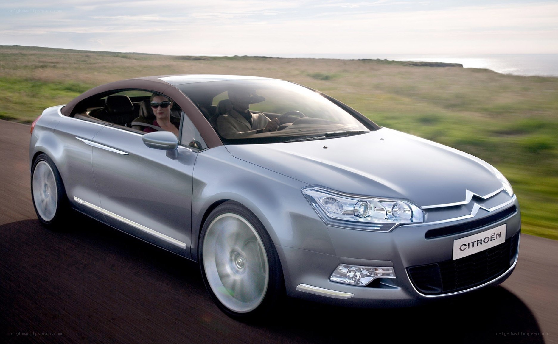 Silver Citroën convertible driving