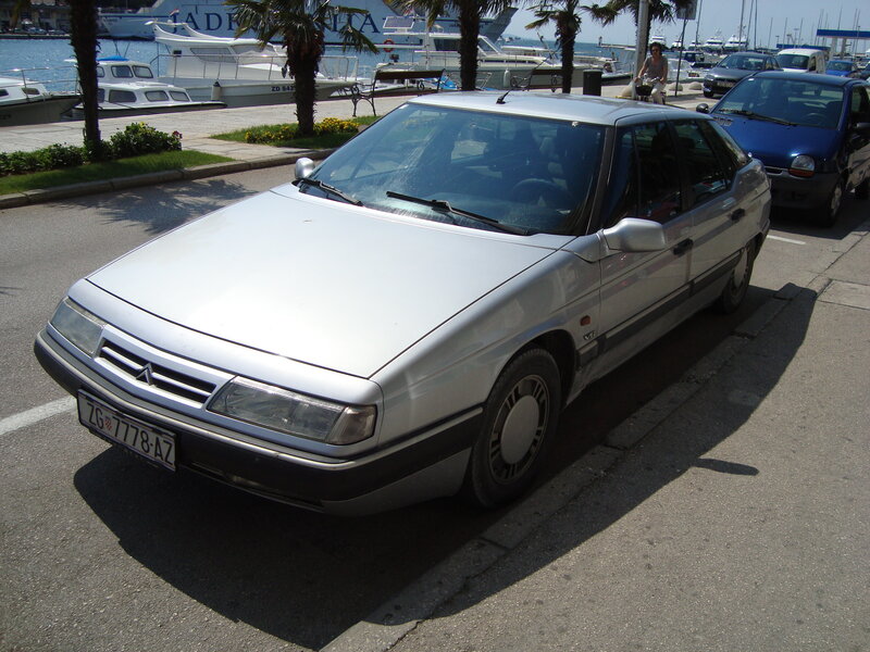 silver citroen parked by marina