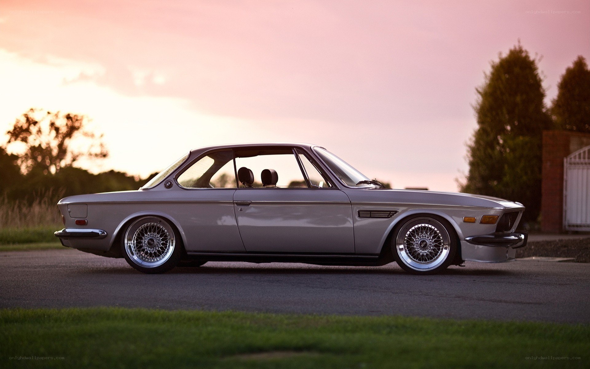 silver classic car at sunset