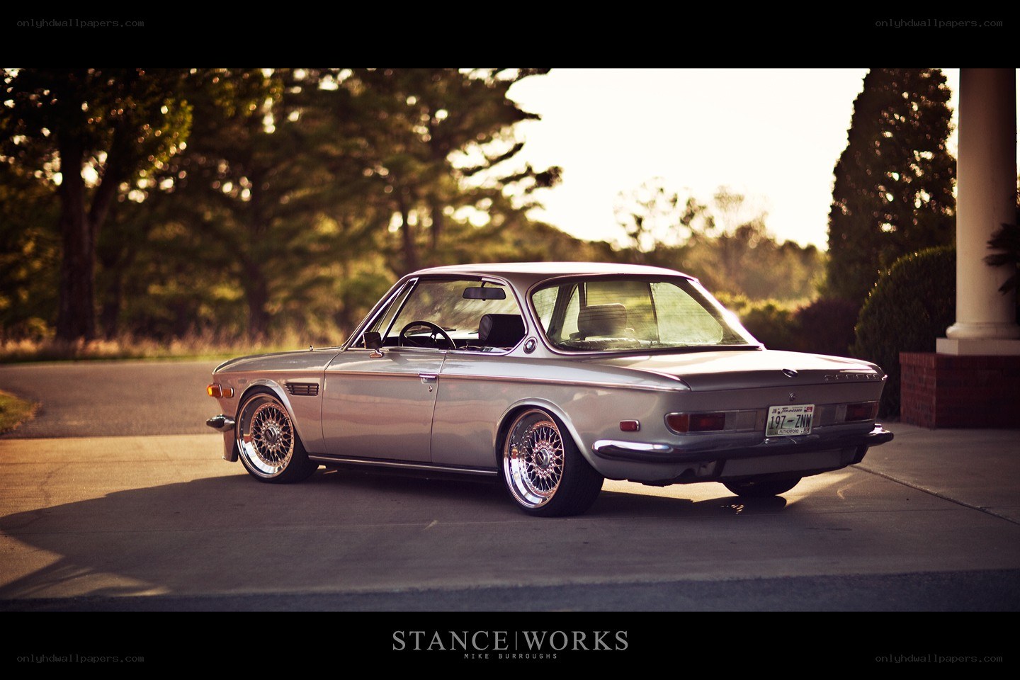silver classic car at sunset