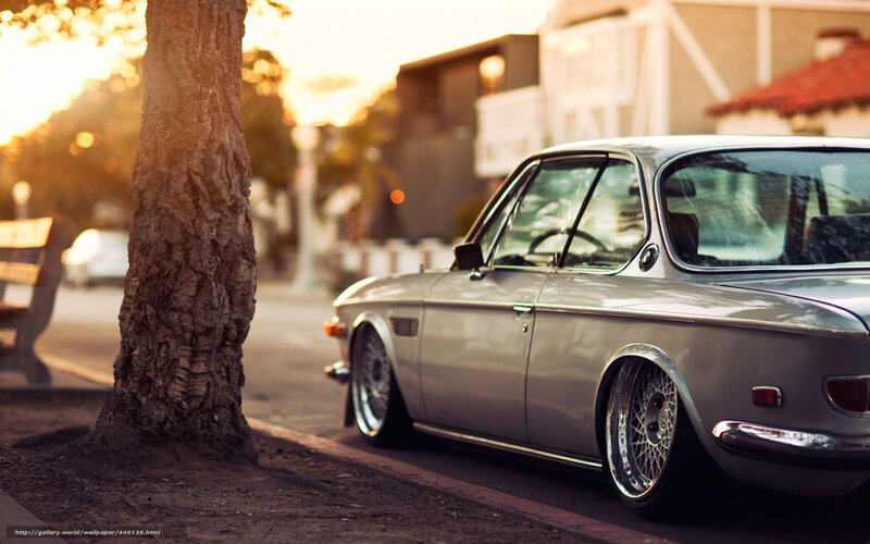 silver classic car at sunset