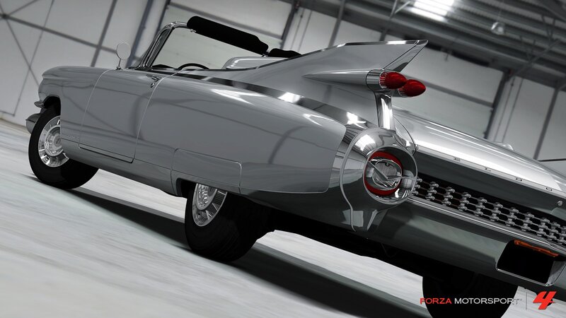 silver classic car in garage