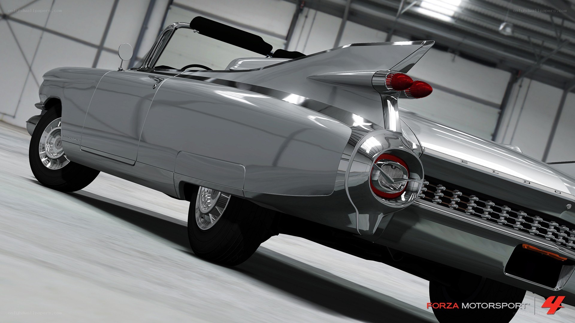 silver classic car in garage
