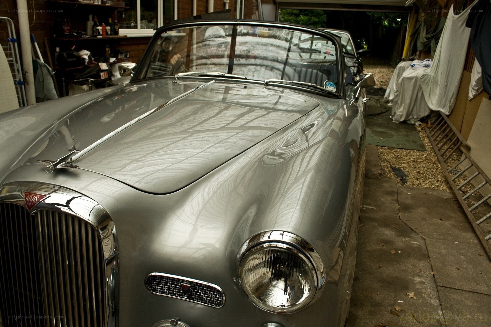 Silver classic car in garage