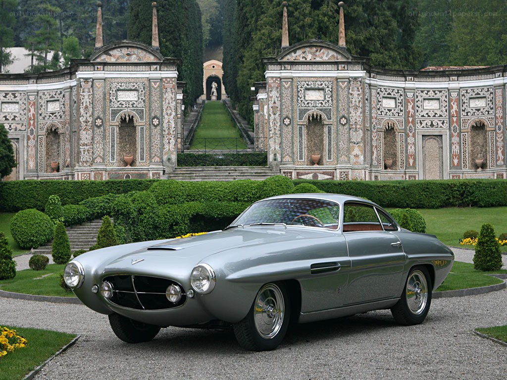 Silver classic car in garden