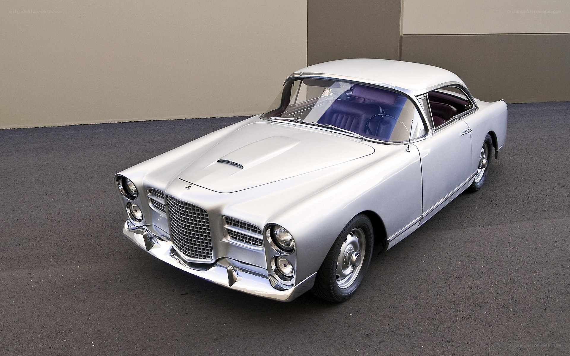 Silver classic car on display