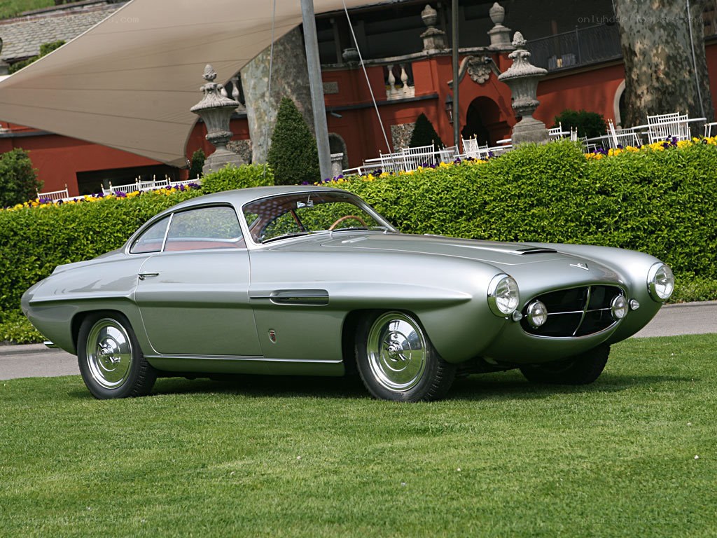 Silver classic car on lawn