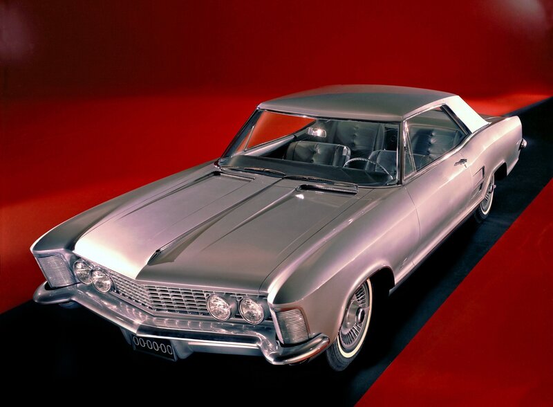 Silver classic car on red background