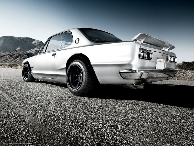 silver classic car on road