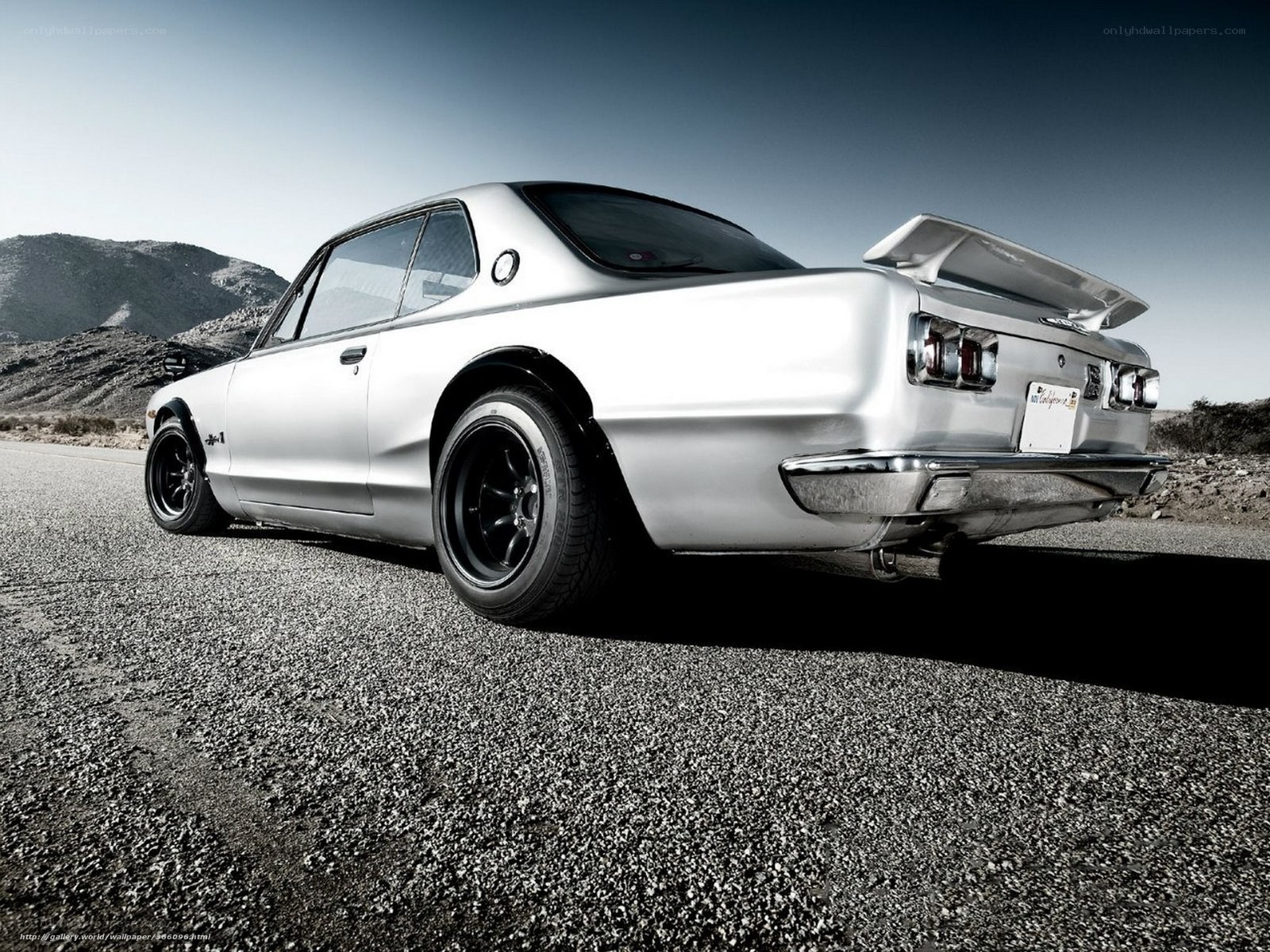 silver classic car on road