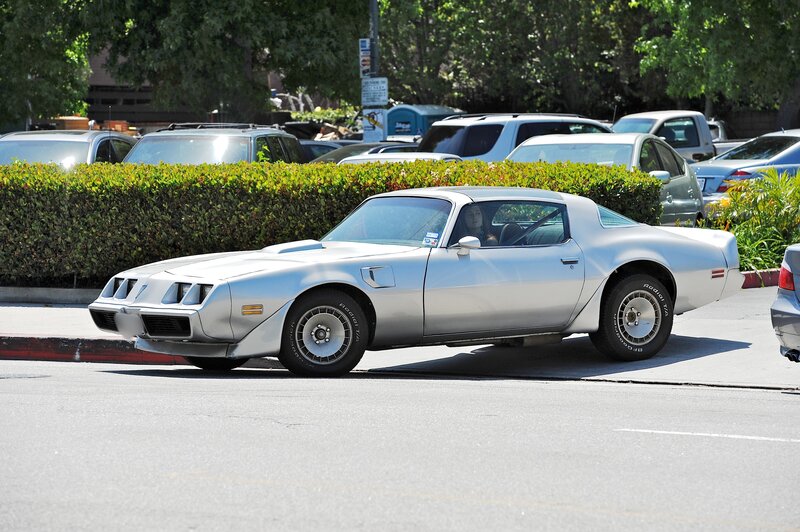 silver classic car on street