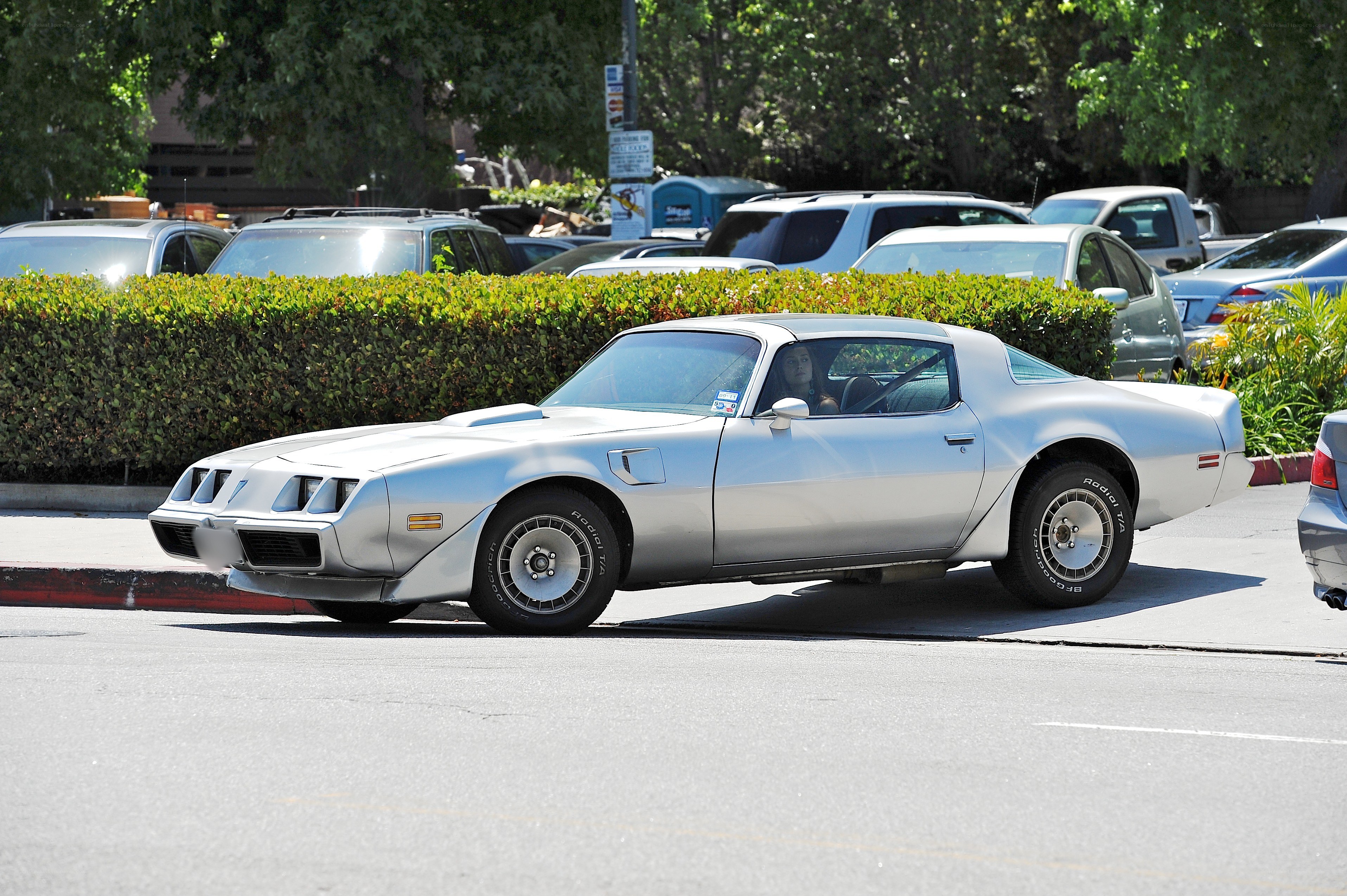 silver classic car on street