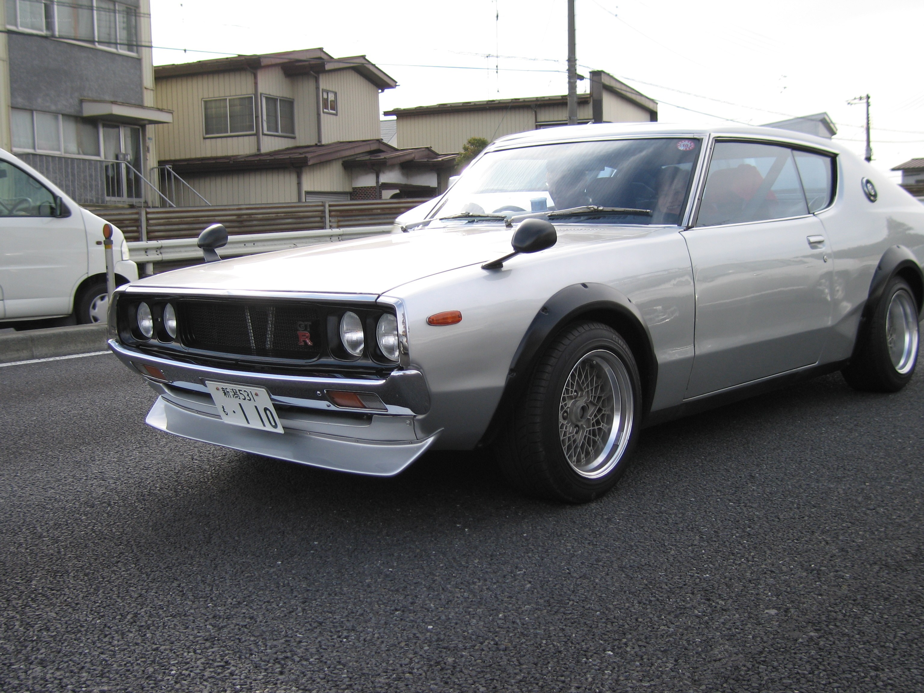 silver classic car on street