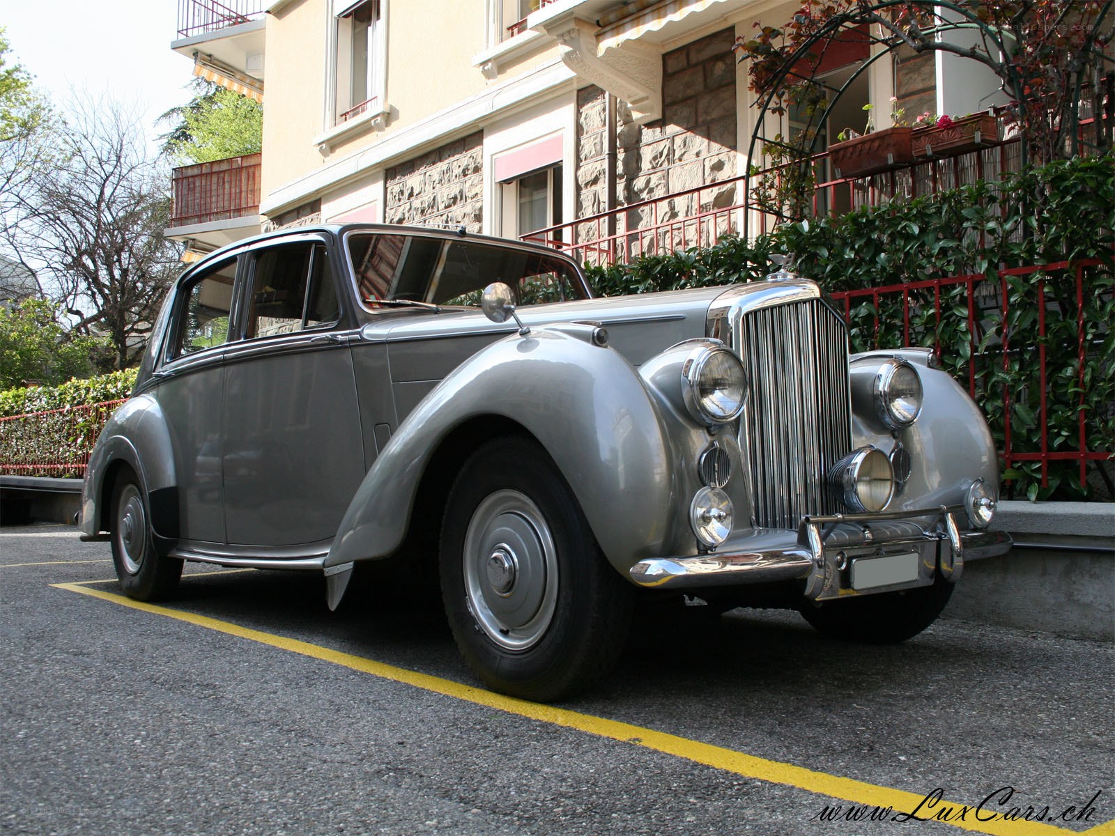 silver classic car parked
