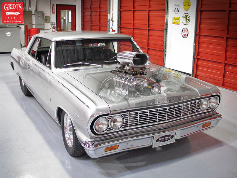 Silver classic car with supercharged engine