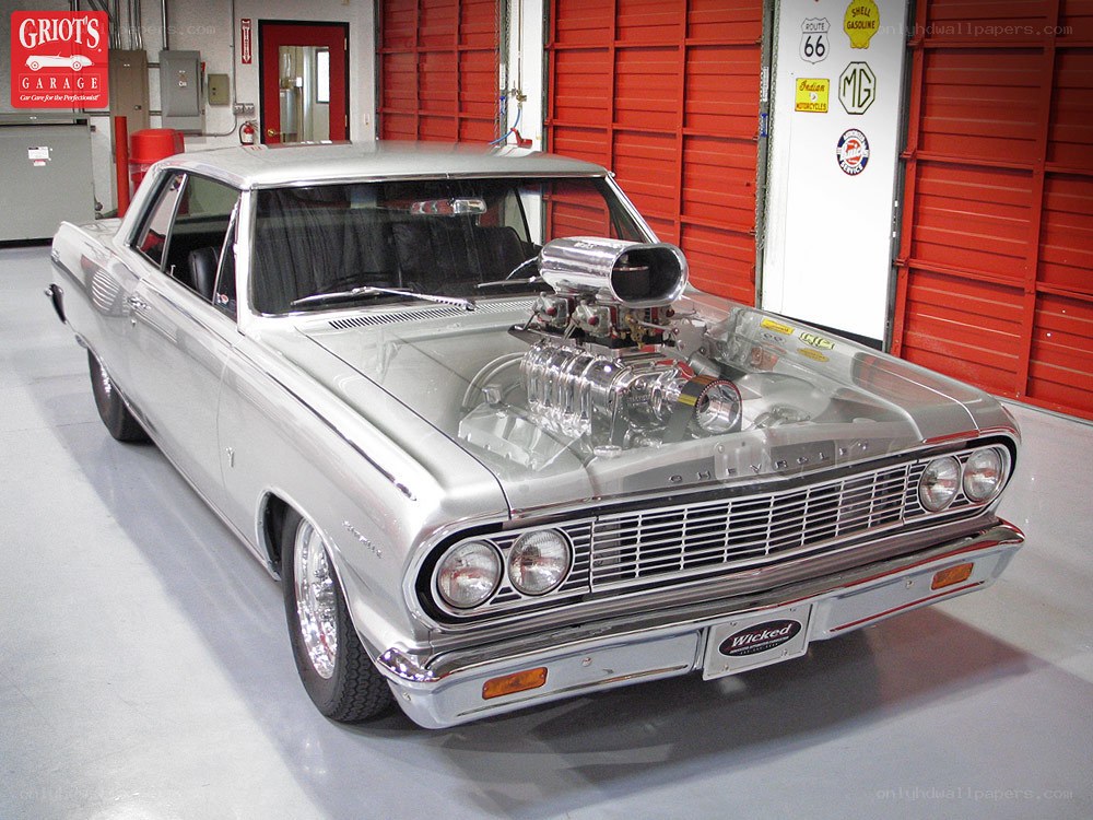 Silver classic car with supercharged engine