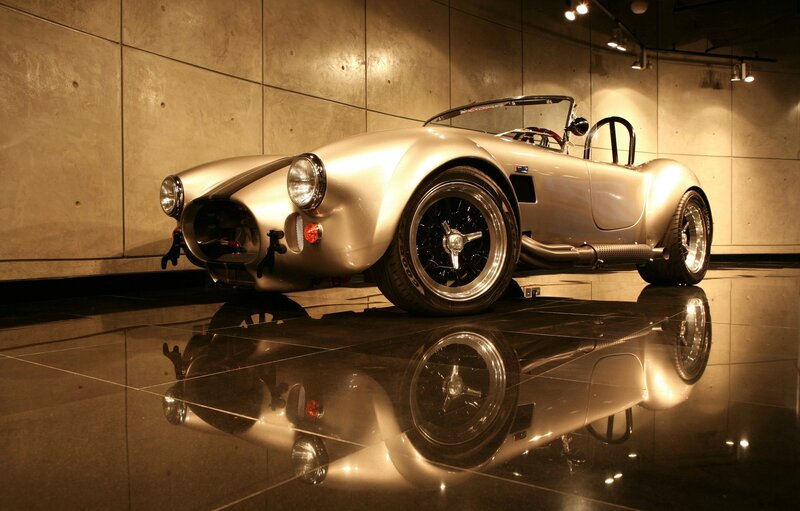 Silver classic sports car on display