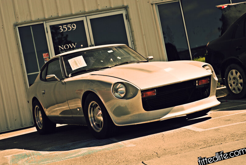 Silver classic sports car parked