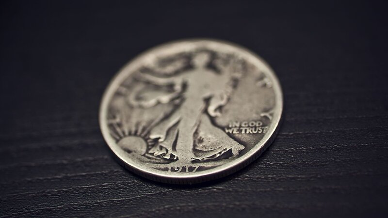Silver Coin on Dark Surface — Black