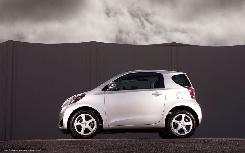Silver compact car on asphalt