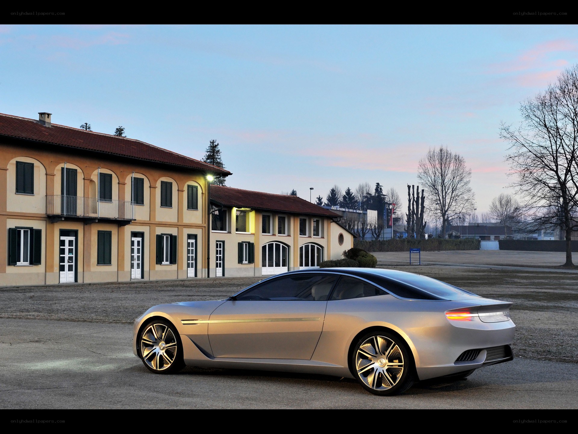 Silver concept car at dusk