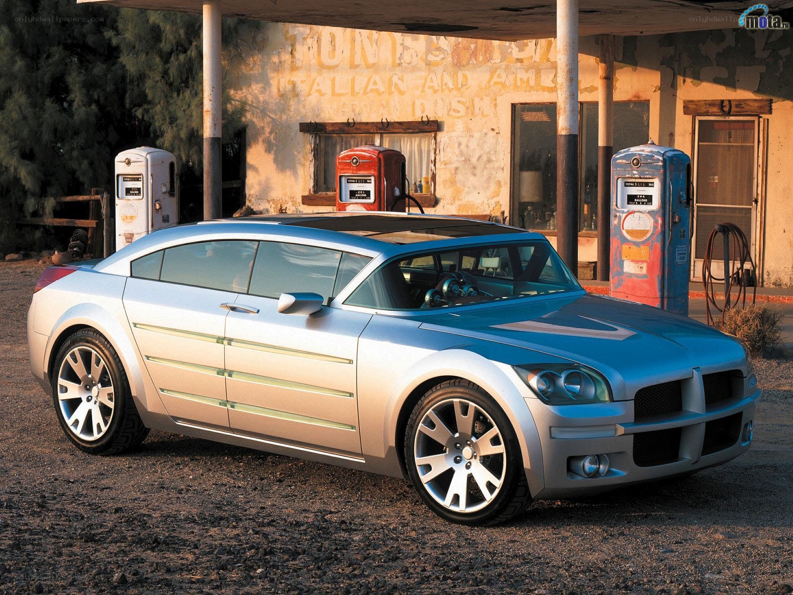 Silver concept car at gas station