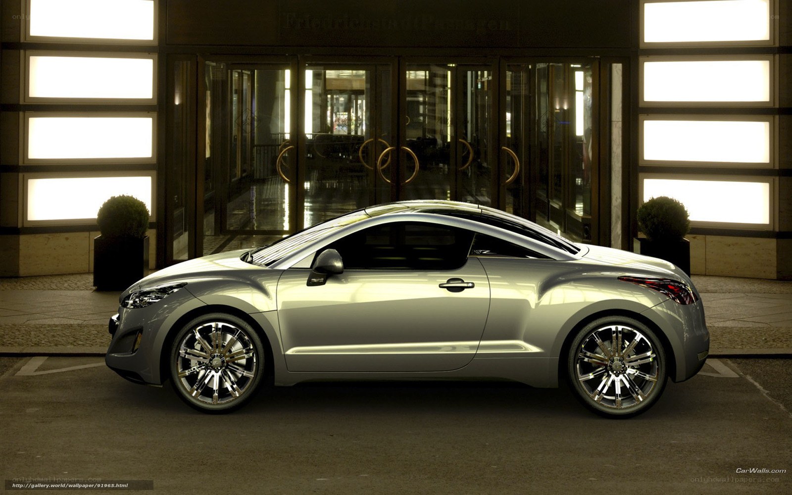 Silver concept car at hotel entrance