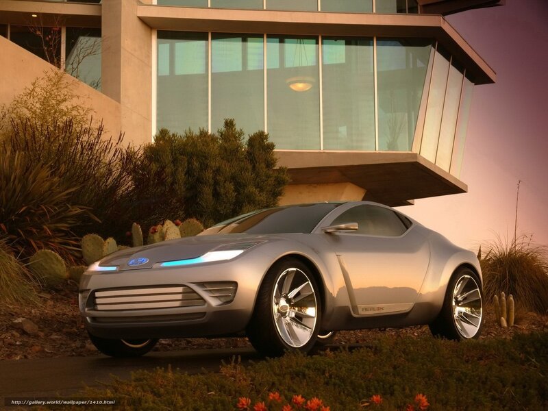 Silver concept car at modern home