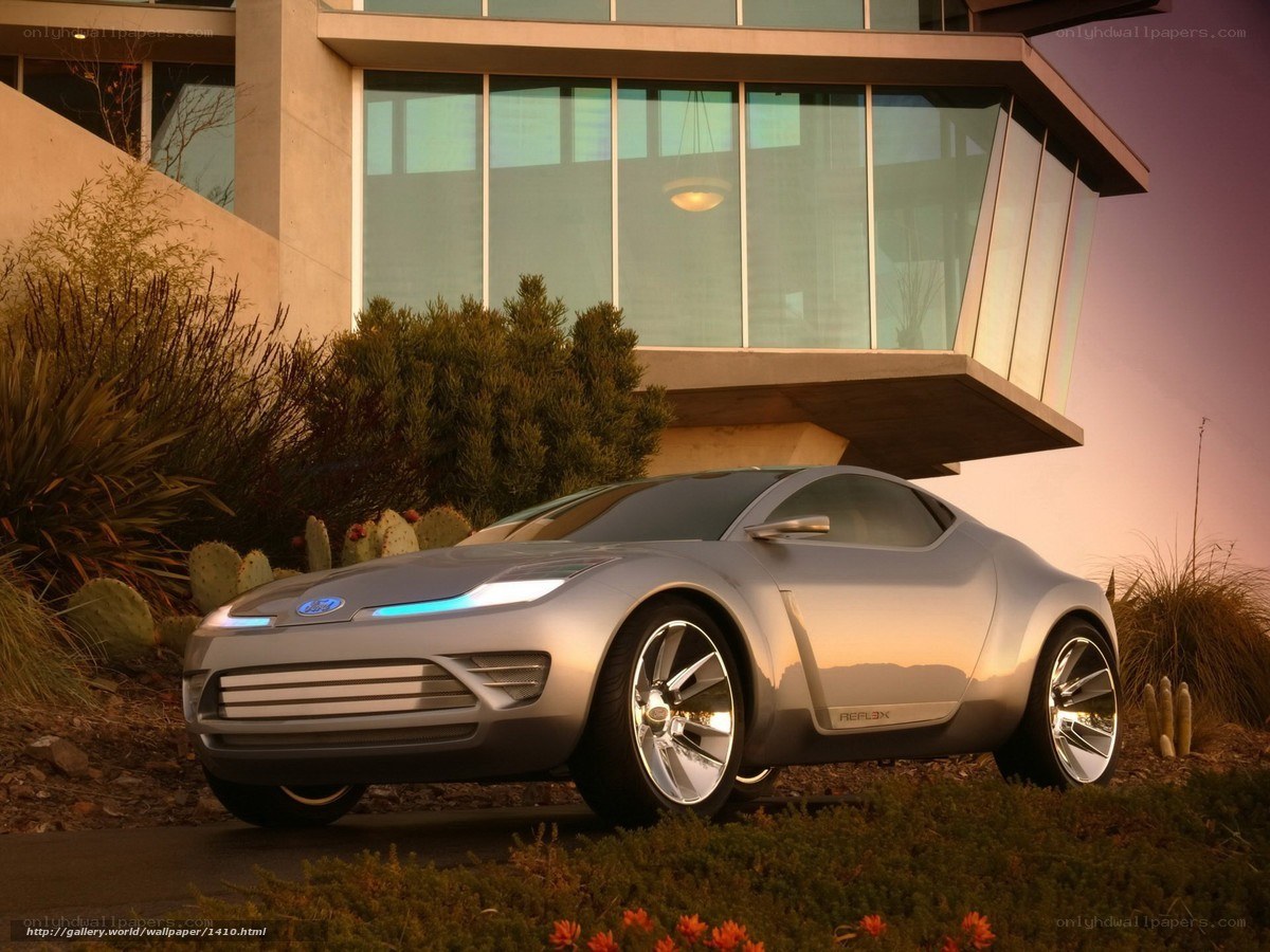 Silver concept car at modern home