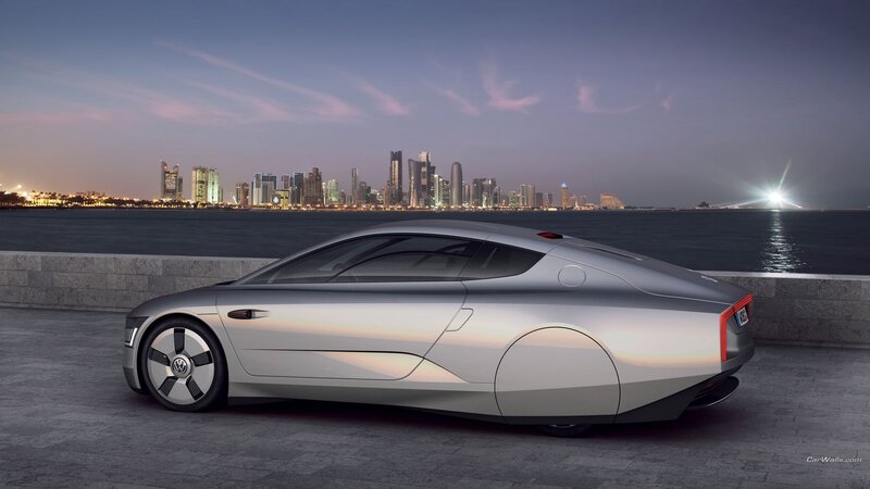 Silver concept car by waterfront