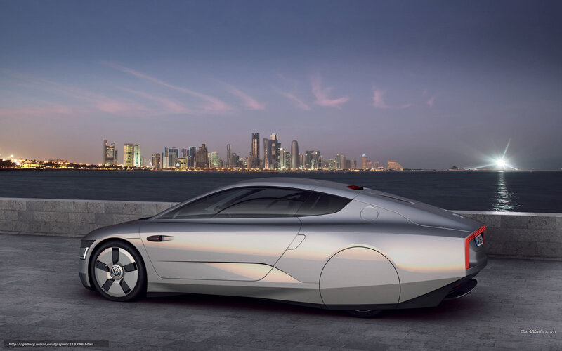 Silver concept car by waterfront