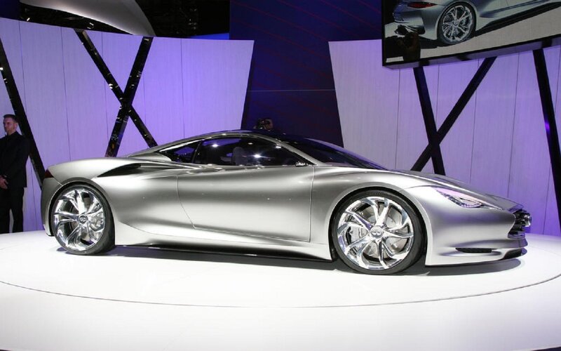 Silver Concept Car — Dramatic, Photograph, Car Show, Display Platform