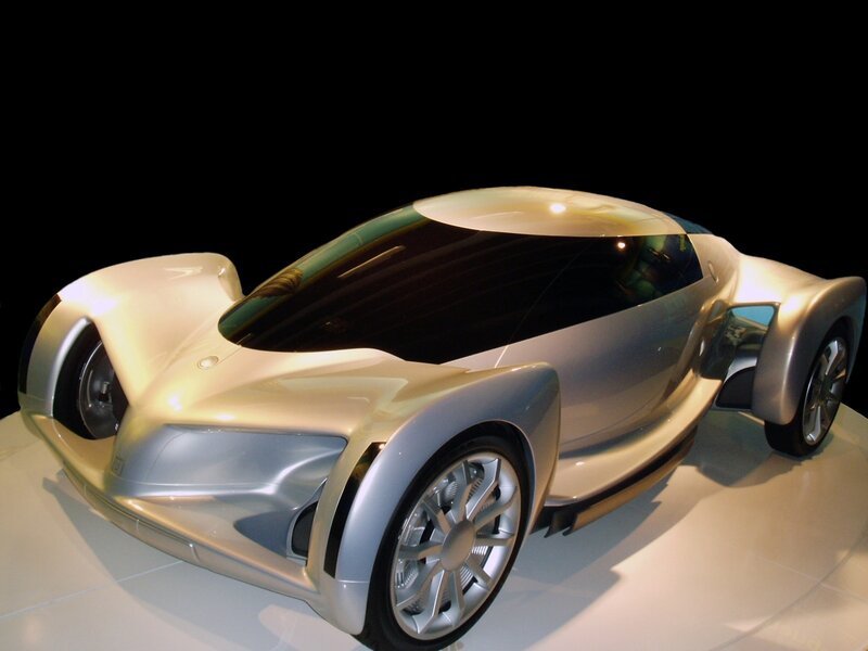 Silver Concept Car — Dramatic, Photograph, Display Stand, Black Background