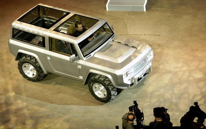 Silver Concept Car — Dramatic, Photograph, Man in Driver Seat