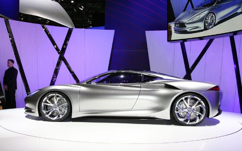 Silver Concept Car — Dramatic, Photograph, Man in Suit, Screen, Display Stand