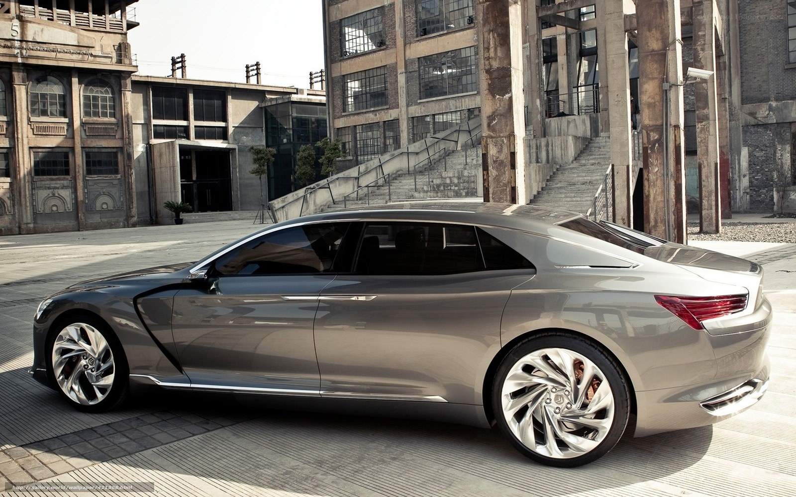 silver concept car in industrial setting